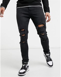 Черные супероблегающие джинсы с рваной отделкой Bershka