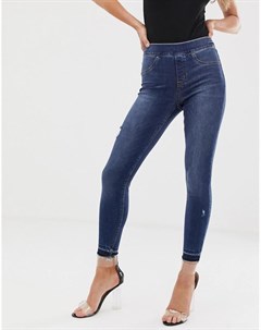 Моделирующие джинсы скинни с рваной отделкой Spanx