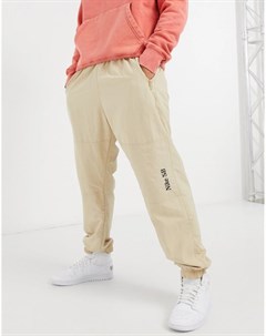Спортивные брюки светло песочного цвета с манжетами и логотипом Classic Nike sb