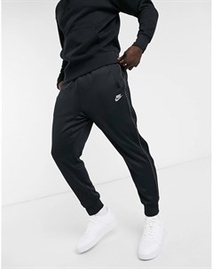 Черные джоггеры с манжетами и отделкой фирменной лентой Repeat Pack Nike