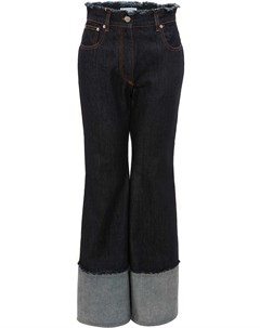Расклешенные джинсы с необработанными краями Jw anderson