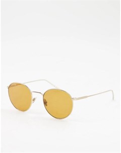 Круглые солнцезащитные очки в золотистой оправе Lacoste