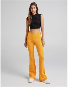 Оранжевые расклешенные брюки с принтом в стиле ретро Bershka