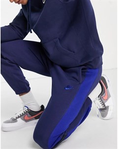 Темно синие джоггеры с манжетами и ярко синими вставками Nike