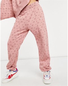 Розовые джоггеры со сплошным принтом логотипа Nike