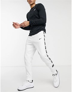 Белые джоггеры с манжетами тесьмой и сплошным логотипом Repeat Pack Nike