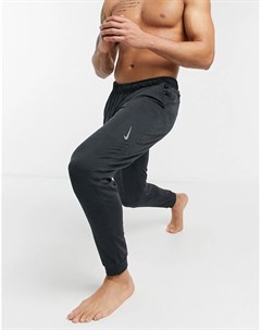 Темно серые джоггеры Nike Yoga Dri FIT Nike training