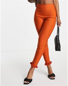 Узкие брюки рыжего цвета с оборками по краю от комплекта Vesper