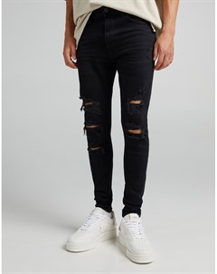 Черные супероблегающие джинсы с прорехами и необработанным краем Bershka
