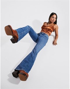 Эластичные комфортные расклешенные джинсы среднего выбеленного оттенка с заниженной талией Asos design