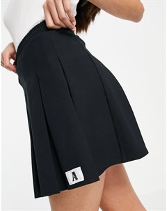 Черная теннисная мини юбка со складками и фирменной нашивкой с буквой A Asos design