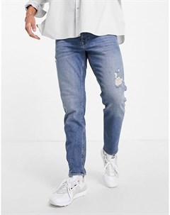 Темно выбеленные в винтажном стиле суженные книзу эластичные джинсы с эффектом состаренности Asos design