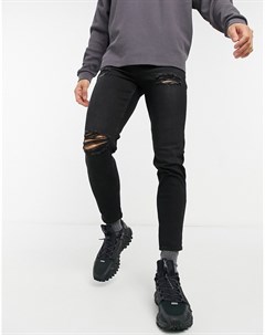Черные суженные книзу джинсы с рваной отделкой New look