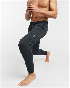 Темно серые джоггеры Nike Yoga Dri FIT Nike training