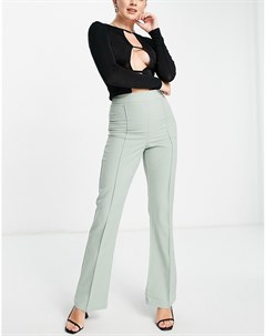 Шалфейно зеленые расклешенные брюки от комплекта Femme luxe