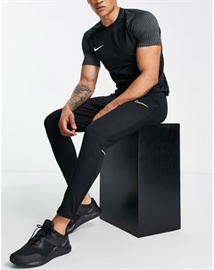Черные с оранжевым джоггеры Academy Nike football