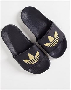 Легкие черные шлепанцы с золотистым логотипом трилистником Adilette Adidas originals