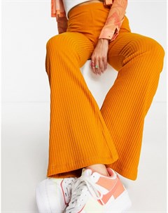 Оранжево горчичные расклешенные брюки в рубчик Asos design