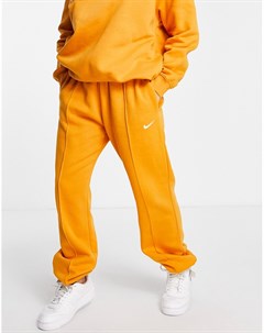 Оранжевые джоггеры в стиле oversized с маленьким логотипом галочкой Nike