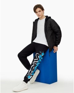 Чёрные спортивные брюки Comfort с граффити принтом для мальчика Gloria jeans