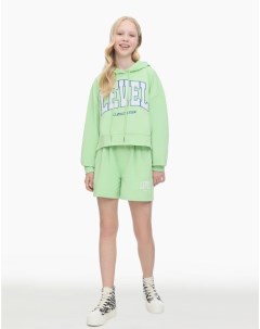Зелёные спортивные шорты с принтом для девочки Gloria jeans