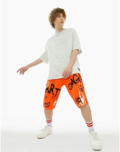 Оранжевые спортивные шорты с граффити принтом для мальчика Gloria jeans