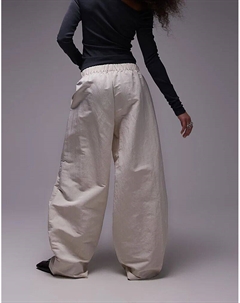 Брюки из атласа с резинкой на талии кремового цвета Mango