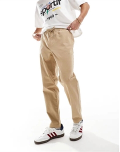 Зауженные брюки-чинос с эластичной талией бежевого цвета Asos design