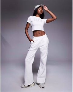 Широкие брюки-джоггеры с вышитым логотипом в белом и песочном цветах Kaiia