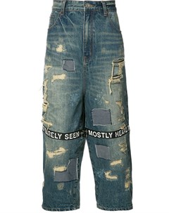 Укороченные джинсы с рваными деталями Mostly heard rarely seen